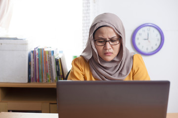 Muslim Businesswoman Working on Laptop at the Office