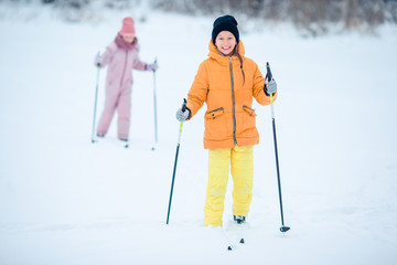 Child skiing in the mountains. Winter sport for kids.