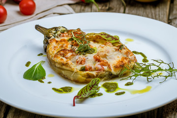 baked eggplant on plate with parmesan