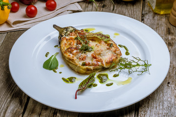 baked eggplant on plate with parmesan