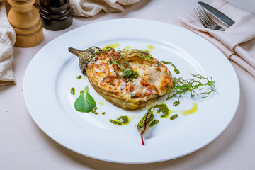 baked eggplant on plate with parmesan