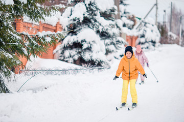 Child skiing in the mountains. Winter sport for kids.