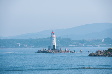 Fototapeta na wymiar Russia, Vladivostok, July 2018: Tokarev lighthouse in summer