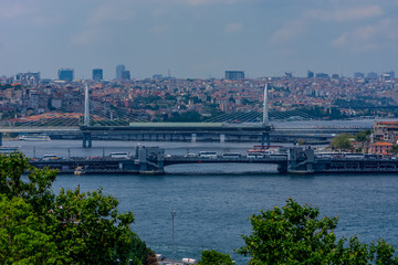 Fototapeta na wymiar Two famous bridges on the bosphorus Golden Horn Metro Bridge and Galata Bridge
