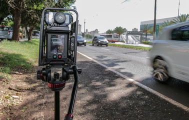 Police radar installed near the road to control the speed limit.