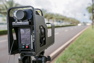 Police radar installed near the road to control the speed limit.