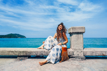 cheerful stylish young woman having fun outdoors