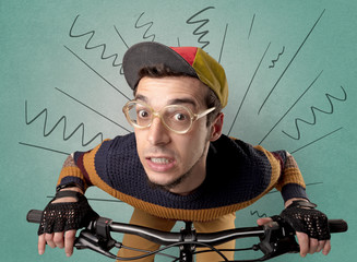 Extreme young cyclist with doodle on the background