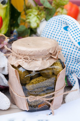 Autumn harvest: can of canned cucumbers