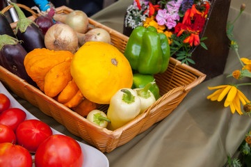 Autumn harvest: vegetables in a basket, zucchini, onions, eggplant, pepper, pumpkin