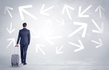 Businessman with back walking away with higgledy-piggledy arrows around
