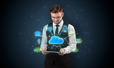 Chalk drawn cloud technology symbols on a tabled handled by businessman
