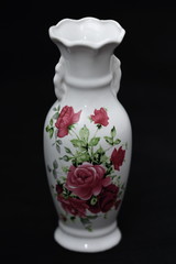 Chinese vase painted with roses on  black background