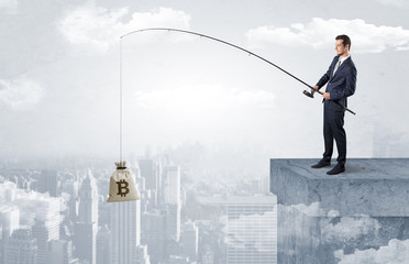 Businessman fishing sack of currency from the cityscape concept
