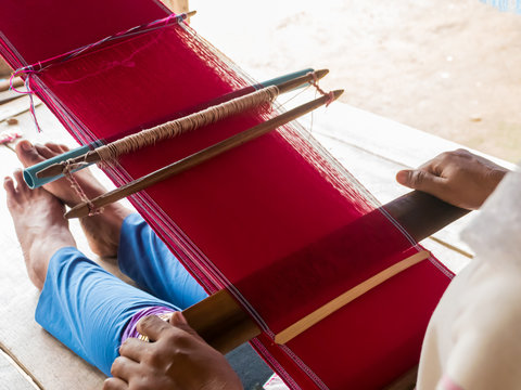 Tribe woman is weaving handicraft work