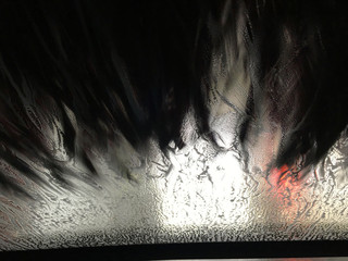Inside of an automobile view of an automatic car wash