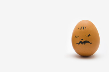 Egg with a painted face, a psychology of feelings serenity Zen on a white background
