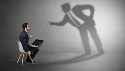 Businessman staying and offering stuffs to a shadow businessman
