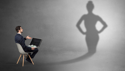 Rich businessman staying and offering stuffs to a pretty shadow woman
