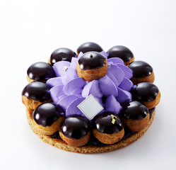 Cute and beautiful small round birthday cake on a white background