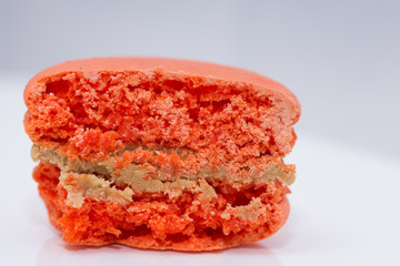 orange  macarons on white background