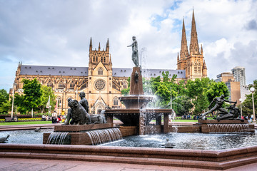 Hyde park fountain with St Mary's Cathedral in background in Sydney Australia