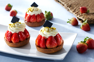 Delicious strawberry cake over white background