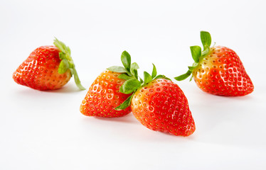 Closeup of strawberries on a white background