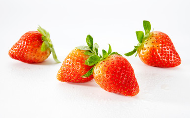 Closeup of strawberries on a white background