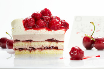 Beautifully designed cherry cake on a white background