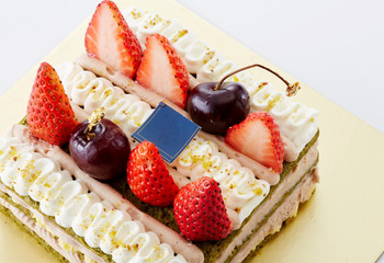 Delicious strawberry cake on white background
