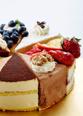 Delicious cake cut pieces collection on white background