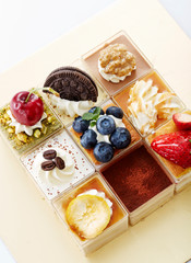 Design beautiful little cakes collection over white background