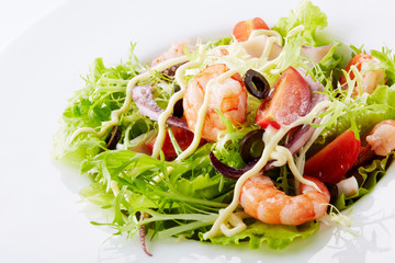 Delicious seafood salad on a white background