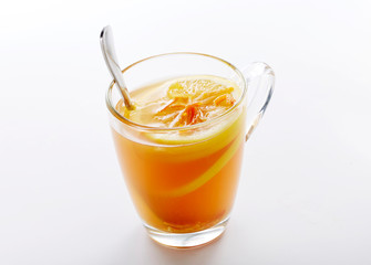 Delicious hot lemon tea on a white background