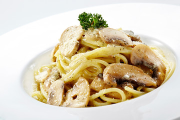 Delicious mushroom pasta over white background