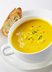Delicious western-style pumpkin soup on a white background