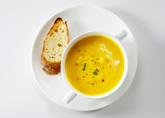Delicious western-style pumpkin soup on a white background