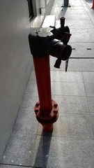 Detail of a Red fire hydrant on the street