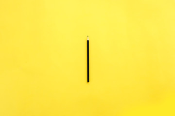 One pencil on yellow background.
