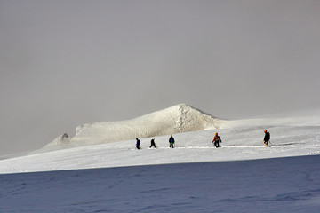 bunch of mountaineers descend from peak of mountain, Fann, Pamir Alay, Tajikistan