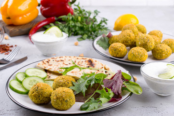 Homemade  falafel balls,sweet red pepper and green fresh parsley. Traditional Middle Eastern food.