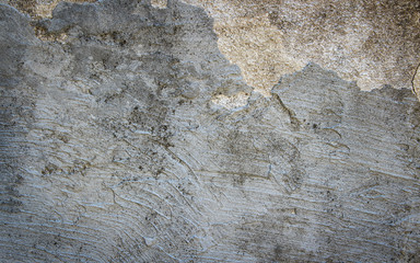 Rugged surface of old grey plastered wall