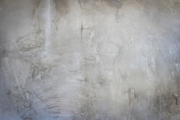Rugged surface of old grey plastered wall