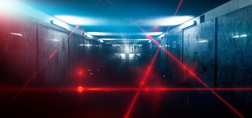 Dark room, street, tunnel, corridor, background with searchlight rays and a red laser beam, smoke, smog, dust. Abstract dark blue background with neon and rays. 