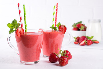 Delicious strawberry smoothie. Morning drinks with fresh berries, yogurt or milk
