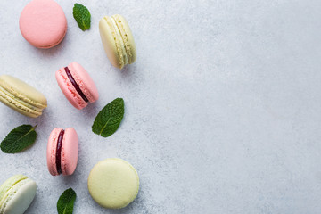 Colorful macaroons on white stone background Top view, Copy Space 