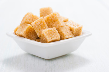 some sugar on white wooden table