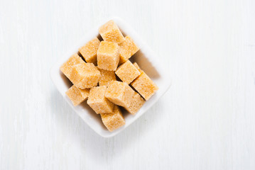 some sugar on white wooden table