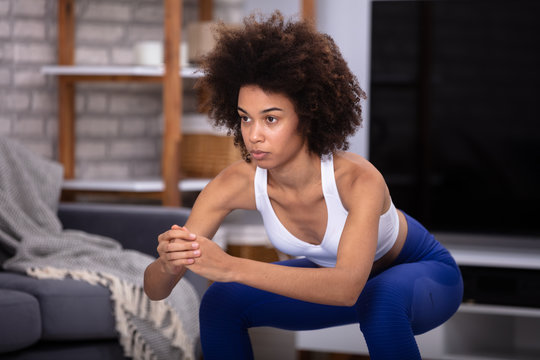 Woman Doing Squat Exercise